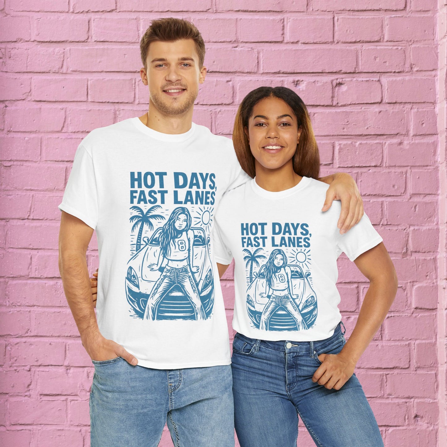 Two people wearing white t-shirts with a graphic design and text against a pink brick wall.