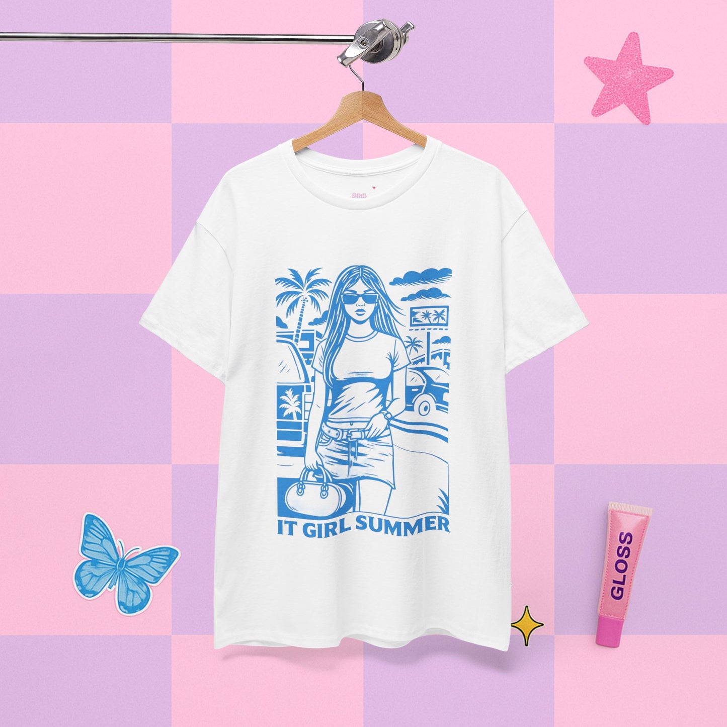 White t-shirt with blue graphic design on a pastel checkered background