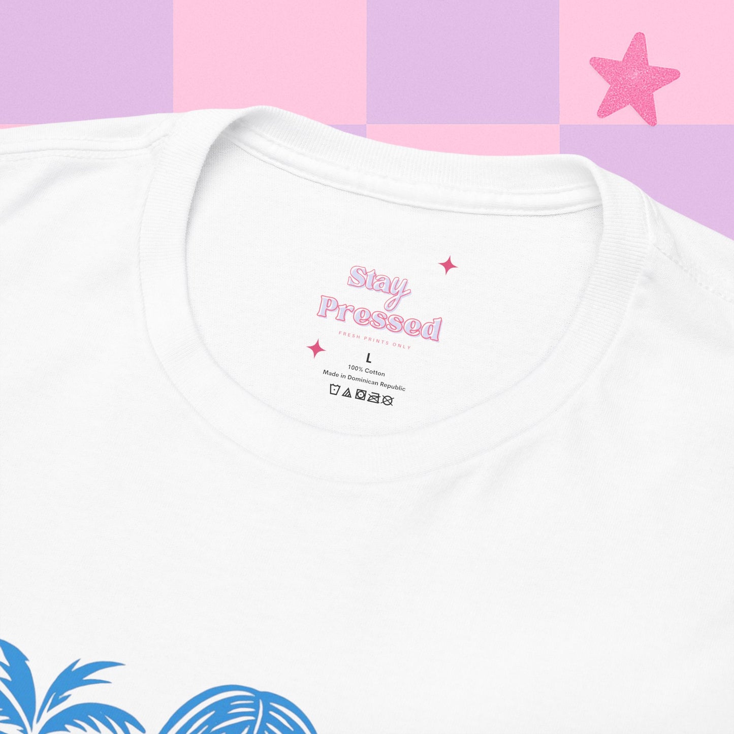 White t-shirt with 'Stay Pressed' text on a pink and purple checkered background
