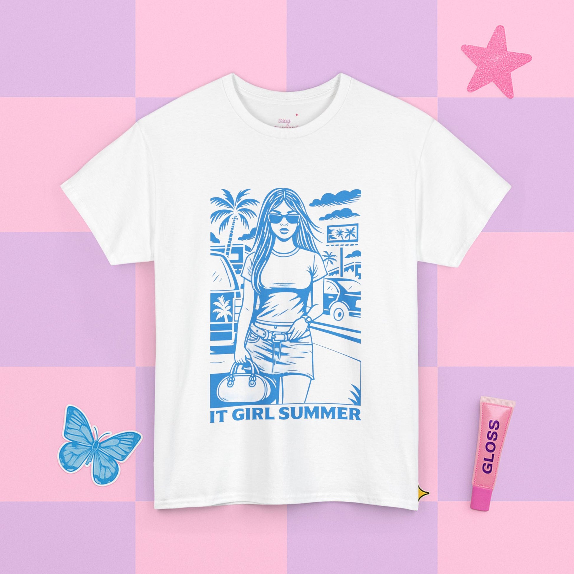 White t-shirt with a blue graphic design on a colorful checkered background